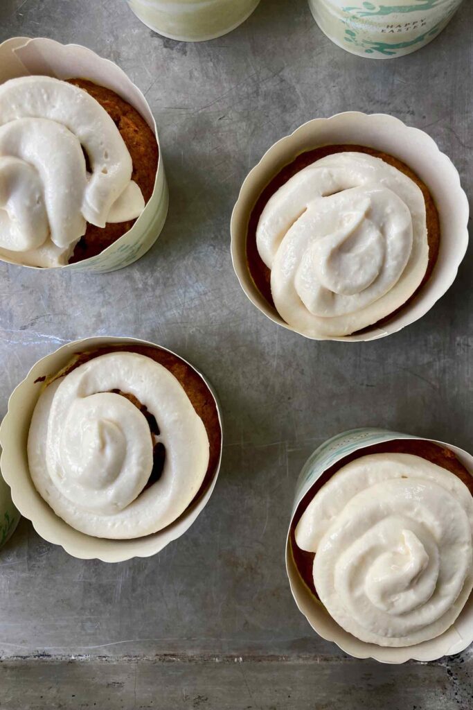 Cream cheese frosting on carrot cake cupcakes