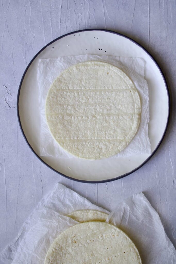 damp paper towels between tortillas
