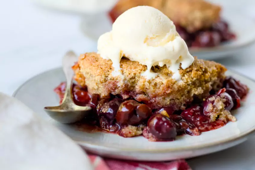 cherry cobbler topped with whole wheat biscuits