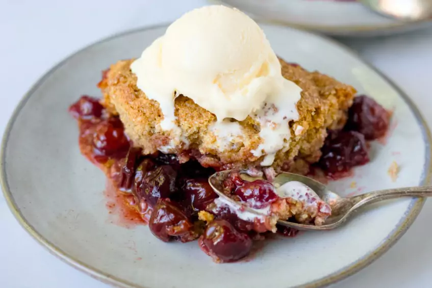cherry cobbler topped with whole wheat biscuits
